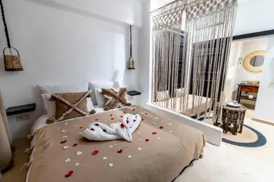 a bedroom with a bed with hearts on it at Riad Dar Yousra in Marrakech