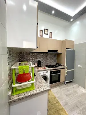 a kitchen with a dish drying rack on the counter at Mima in Marrakech