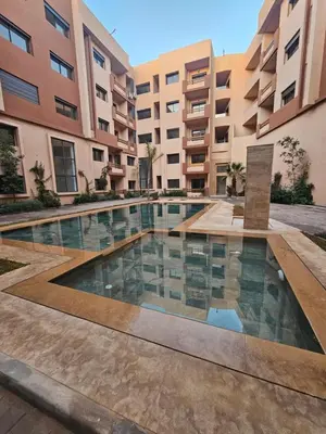 a swimming pool in the middle of a building at Studio Central Nour in Marrakech