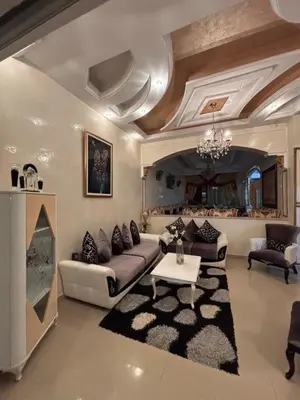 a living room with a couch and a table at Villa Saber in Marrakech