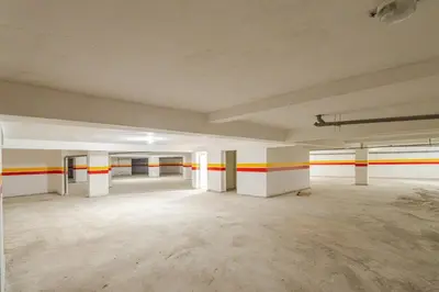 an empty room with red and yellow stripes on the walls at Cosy appartement au centre ville hivernage marrakech in Marrakech