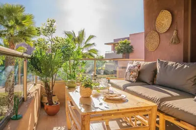 a living room with a couch and a table at Wonderfull Place in Marrakech - Pool Wifi Terrace in Marrakech
