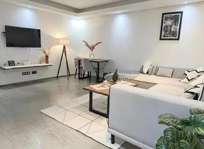 a living room with a couch and a table at Ruby in Marrakech