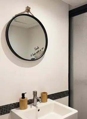 a bathroom with a mirror above a sink at Ruby in Marrakech