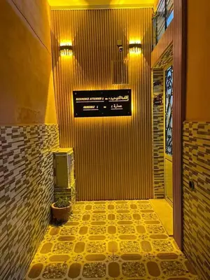a hallway of a bathroom with a sign on the wall at Apparetement 2 chambres in Marrakech