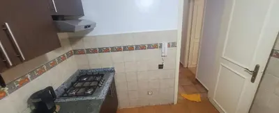 a kitchen with a stove top oven in a room at Well-equipped apartment for rent in Marrakech