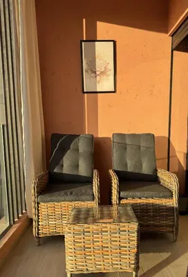 two chairs and a wicker chair in a room at Welcome Home! in Marrakech