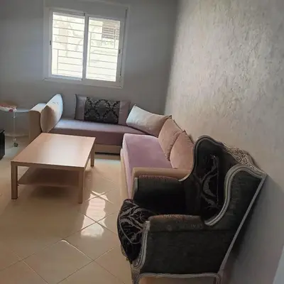 a living room with a couch and a coffee table at marrakech mountazah al jadid in Marrakech