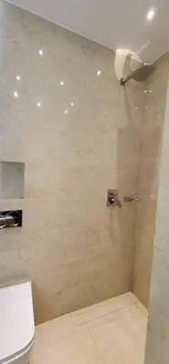 a bathroom with a shower with a toilet in it at الراحة والسلامة مراكش in El Gouassem
