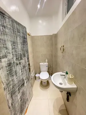 a bathroom with a toilet and a sink at Modern et calme a Marrakech in Marrakech