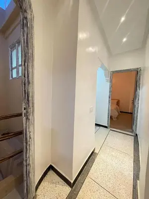 a room with a mirror and a hallway at Modern et calme a Marrakech in Marrakech