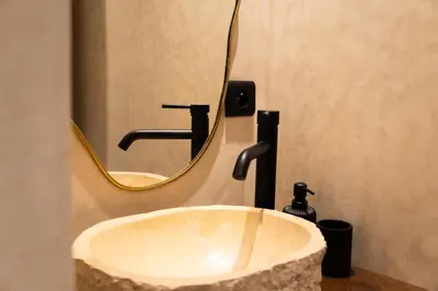 a sink in a bathroom with a mirror at Suite cosy en hypercentre in Marrakech
