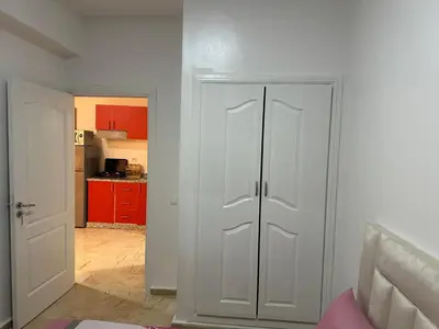 a white closet in a room with a kitchen at l'évasion 8 face gare CTM Hivernage a 10mn de l'aéroport in Marrakech