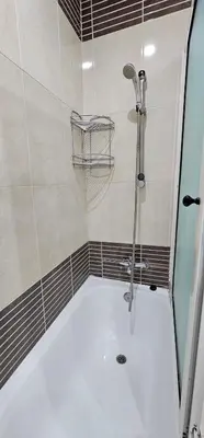 a bathroom with a shower with a white tub at Luxury apartment in Gueliz, near the Majorelle Garden and Yves Saint Laurent Museum in Marrakech