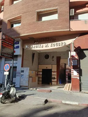 a motorcycle parked in front of a building at Gueliz Boutique Apartment in Marrakech