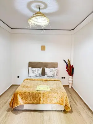 a bedroom with a bed and a ceiling at le numéro 7 in Marrakech