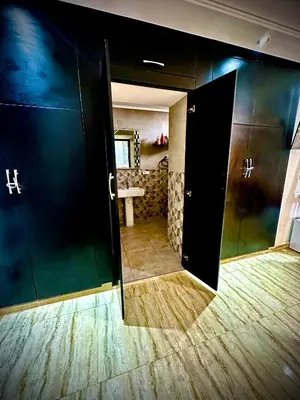 an open door to a bathroom with a sink at المحاميد 10 in Marrakech