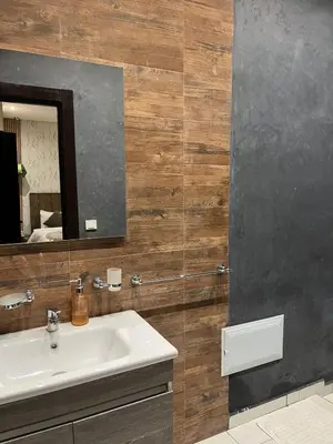 a bathroom with a sink and a mirror at villa abraj in Marrakech