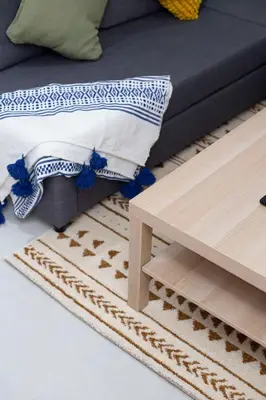 a coffee table next to a bed and a table at Majorelle Elegance City Center in Marrakech