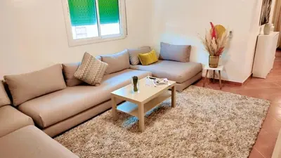 a living room with a couch and a coffee table at Immob in Marrakech