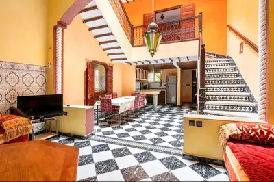a living room with a black and white checkered floor at Blue Room in Marrakech