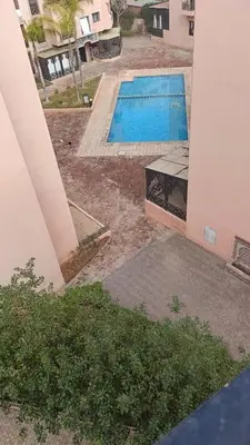 a view of a swimming pool from a house at Premium village c1866 in Marrakech