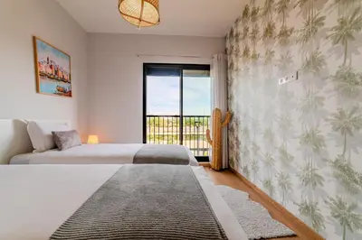 a bedroom with two beds and a window at Luxury and Serenity at Noria Golf and Pool in Marrakech