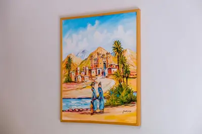 a painting of a house on a wall at Luxury and Serenity at Noria Golf and Pool in Marrakech