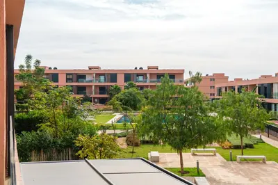 a view of an apartment complex from a balcony at Luxury and Serenity at Noria Golf and Pool in Marrakech