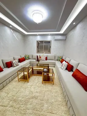 a living room with a couch and a table at Nice apartment in Cherifia in Marrakech