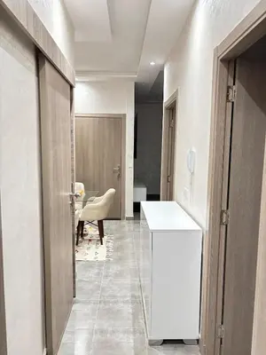 a hallway with a white counter in a room at Nice apartment in Cherifia in Marrakech