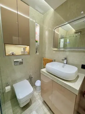 a bathroom with a sink and a toilet and a mirror at Nice apartment in Cherifia in Marrakech