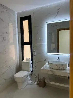 a bathroom with a toilet and a sink and a mirror at Villa Marrakech karim in Marrakech