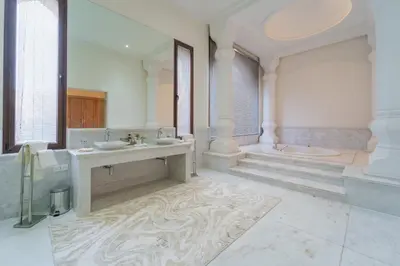a large bathroom with two sinks and a tub at Palais Les Orchidées - Villa de Luxe à 15 minutes du Centre in Marrakech