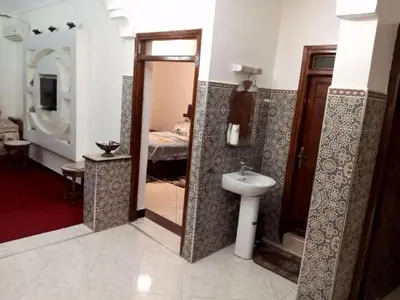 a bathroom with a sink and a toilet in a room at Spacious Apt - Near Airport - Perfect for Groops! in Marrakech