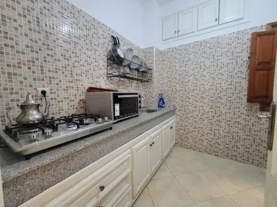 a kitchen with a stove and a microwave at Authentic stay 2 in Marrakech Comfort & Charm in Marrakech