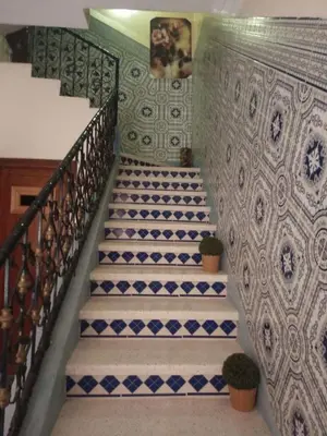 a staircase in a building with blue and white tiles at Large 1-Bed Apt, Perfect for You! in Marrakech