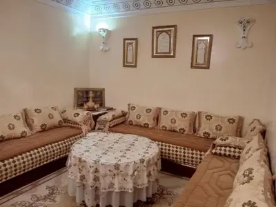 a living room with a couch and a table at Large 1-Bed Apt, Perfect for You! in Marrakech