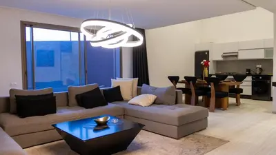 a living room with a couch and a table at IMMOB Zak in Marrakech