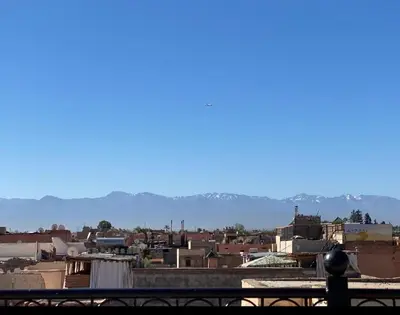 a view of a city with mountains in the background at Riad Palais Bahia - Entire House - 5 Bedrooms in Marrakech