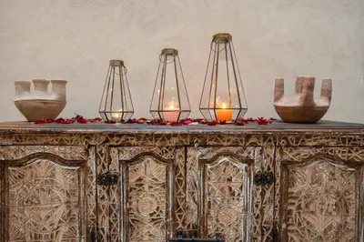 a table with three lights on top of it at Riad Tassili Boutique in Marrakech