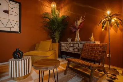 a living room with a couch and a chair at Riad Tassili Boutique in Marrakech
