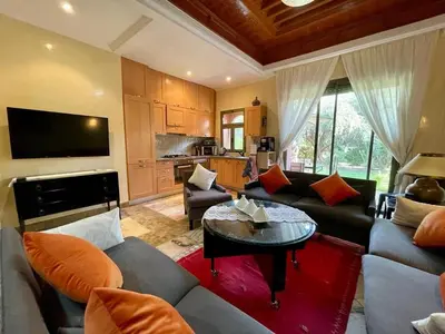 a living room with a couch and a table at Appartement à Marrakech in Marrakech