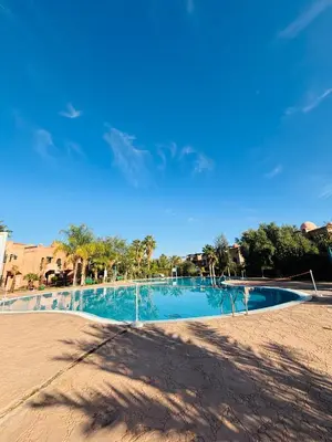 a view of a swimming pool in a resort at Dar Sawan - Beautiful 2rooms & terrace at Atlas golf Palmeraie in Marrakech