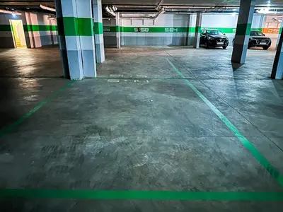 an empty parking garage with a car parked in it at Perl garden in Marrakech