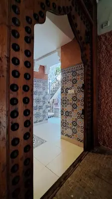 an open door to a room with tiles on the wall at Maison Imane Marrakech in Marrakech