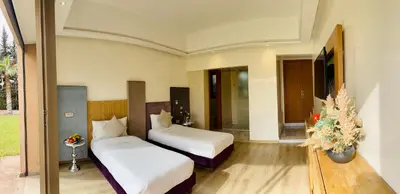 a bedroom with two beds in a room at Hala Luxury Domain in Marrakech