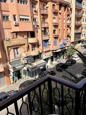 a view of a city street from a balcony at Comfortable apartment in the center of Gueliz in Marrakech