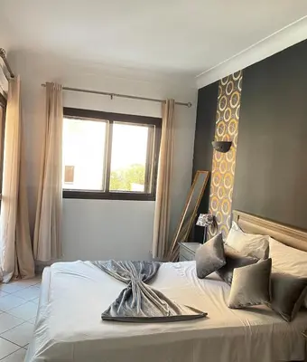a bed with a plate on it in a bedroom at Comfortable apartment in the center of Gueliz in Marrakech