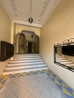 an empty hallway with stairs in a building at Appartement Spacieux A Majorelle in Marrakech
